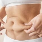close-up-hands-holding-belly_23-2148889319