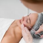beautician-doing-injection-filler-female-client_23-2148875435