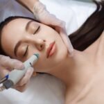 professional-female-cosmetologist-doing-hydrafacial-procedure_302872-23
